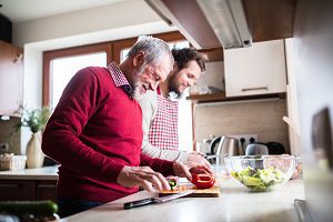 father son cooking